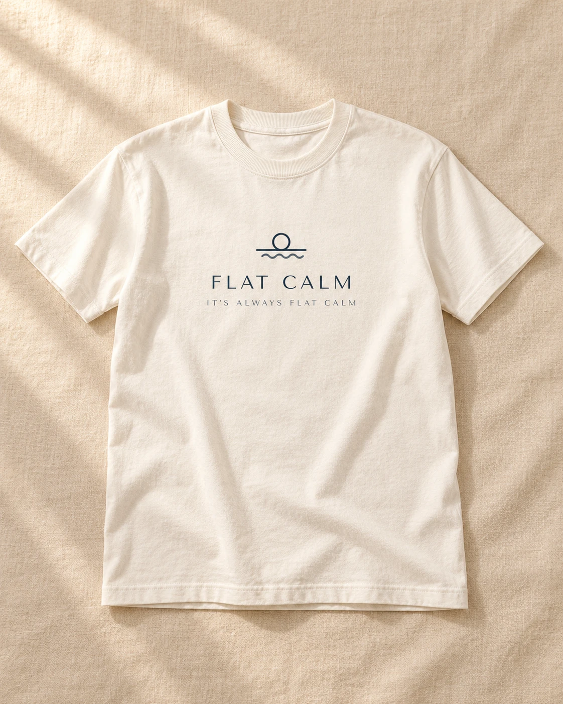 Off-white Daybreak tee with the navy Flat Calm logo